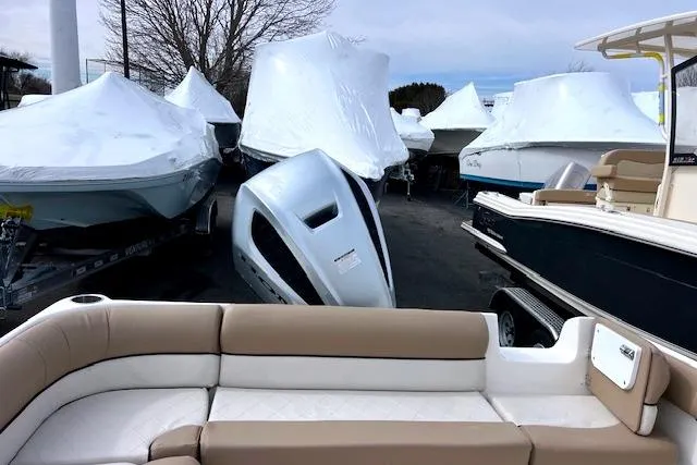 Slide: The Image of 2020 Key West 239 DFS boat in storage, surrounded by covered boats. - 8