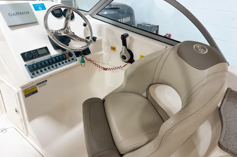 Slide: The Image of 2023 Key West 239 DFS boat cockpit with Garmin navigation and comfortable seating. - 10