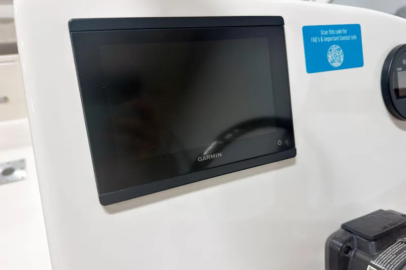 Slide: The Image of Garmin display on 2023 Key West 239 DFS boat dashboard with QR code for contact info. - 11
