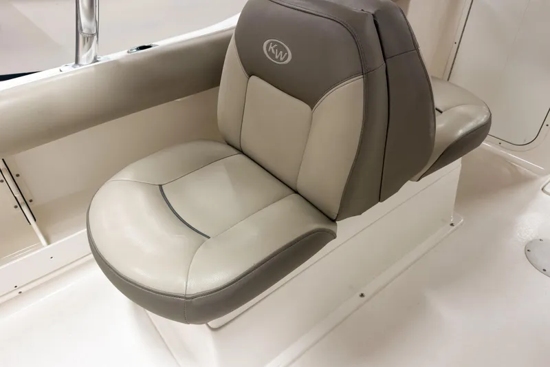 Slide: The Image of 2023 Key West 239 DFS boat seat with beige and gray upholstery. - 13