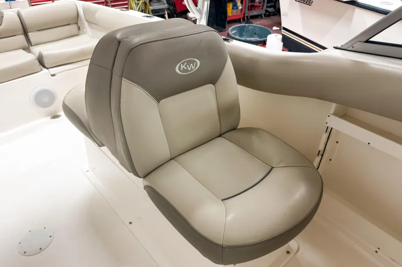 Slide: The Image of 2023 Key West 239 DFS boat seat with beige upholstery and KW logo. - 14