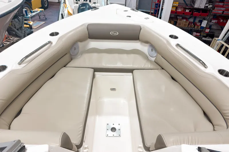 Slide: The Image of 2023 Key West 239 DFS boat interior with beige seating and cup holders. - 17