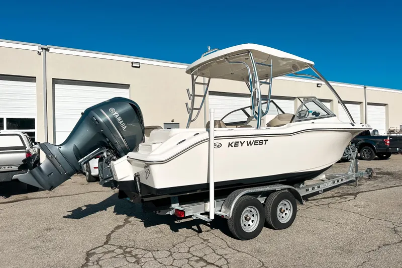 Slide: The Image of 2023 Key West 239 DFS boat on trailer with Yamaha outboard motor. - 2