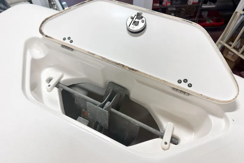 Slide: The Image of Open anchor compartment on 2023 Key West 239 DFS boat, showcasing storage design. - 20