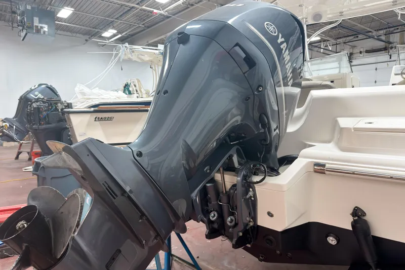 Slide: The Image of 2023 Key West 239 DFS boat with Yamaha outboard motor in a showroom. - 27