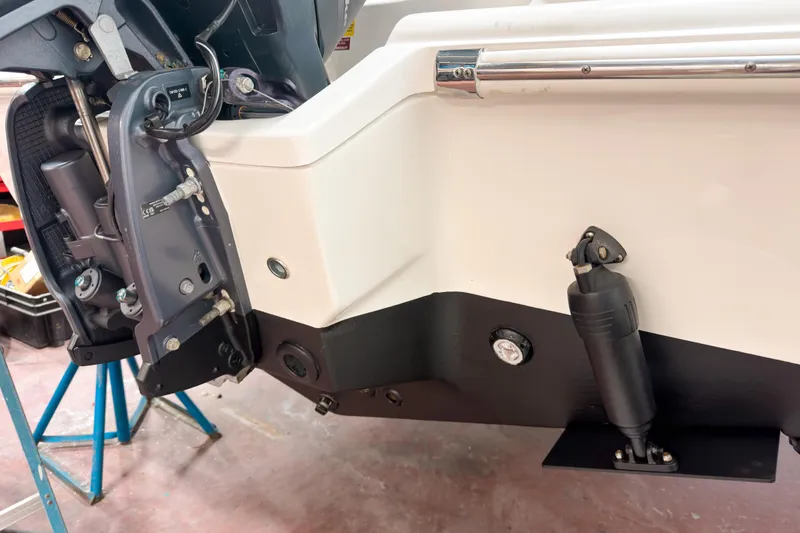 Slide: The Image of 2023 Key West 239 DFS boat engine and trim tab detail in workshop. - 29