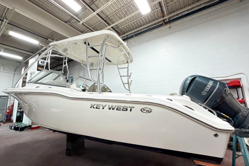 Slide: The Image of 2023 Key West 239 DFS boat in a showroom with Yamaha engine. - 4