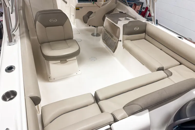 Slide: The Image of 2023 Key West 239 DFS boat interior with beige seating and modern design. - 9