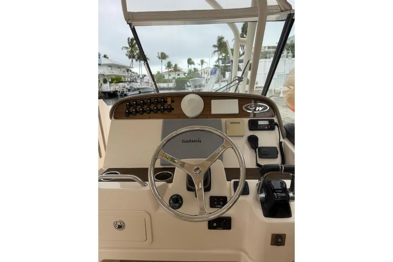 Slide: The Image of Helm of 2015 Grady-White Freedom 335 boat with Garmin and Simrad electronics. - 11