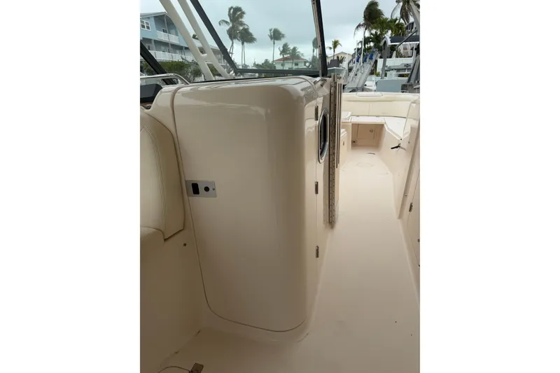Slide: The Image of 2015 Grady-White Freedom 335 boat interior, showcasing sleek design and spacious layout. - 13
