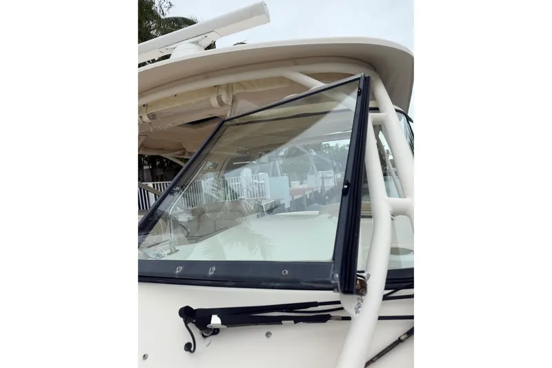 Slide: The Image of 2015 Grady-White Freedom 335 boat windshield and wiper detail. - 19