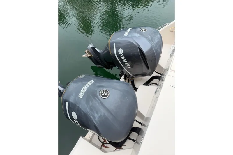 Slide: The Image of Twin Yamaha outboard engines on a 2015 Grady-White Freedom 335 boat. - 22