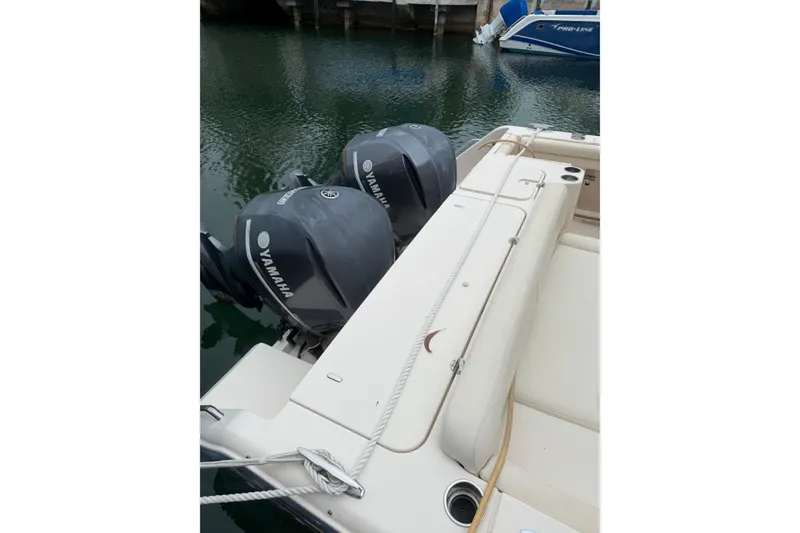 Slide: The Image of 2015 Grady-White Freedom 335 boat with twin Yamaha outboard engines docked. - 23
