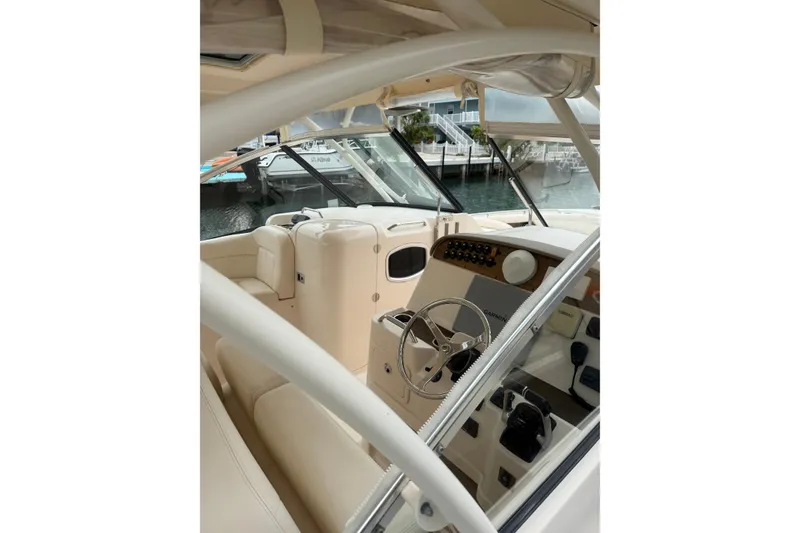 Slide: The Image of Interior view of 2015 Grady-White Freedom 335 boat, featuring steering wheel and dashboard. - 26