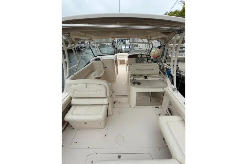 Slide: The Image of 2015 Grady-White Freedom 335 boat interior with seating and helm station. - 3