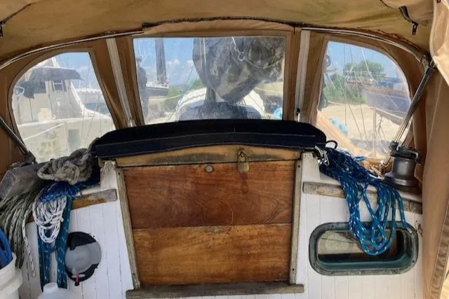 Slide: The Image of 1979 Bristol Channel Cutter interior with ropes and wooden paneling. - 11