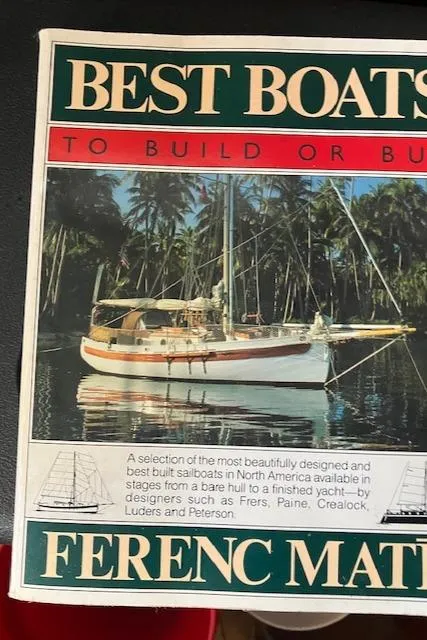 Slide: The Image of "Best Boats" book cover featuring a 1979 Bristol Channel Cutter sailboat anchored near palm trees. - 22
