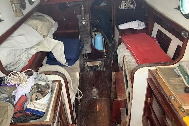 Slide: The Image of Interior of a 1979 Bristol Channel Cutter sailboat, showcasing a cozy cabin space. - 27