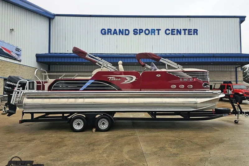 The Image of 2012 Tahoe Pontoon Vision 25' boat on trailer at Grand Sport Center. - 1