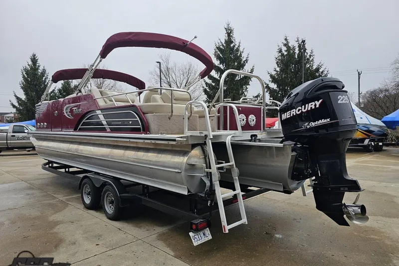 Slide: The Image of 2012 Tahoe Pontoon Vision 25' boat with Mercury 225 OptiMax engine on trailer. - 10