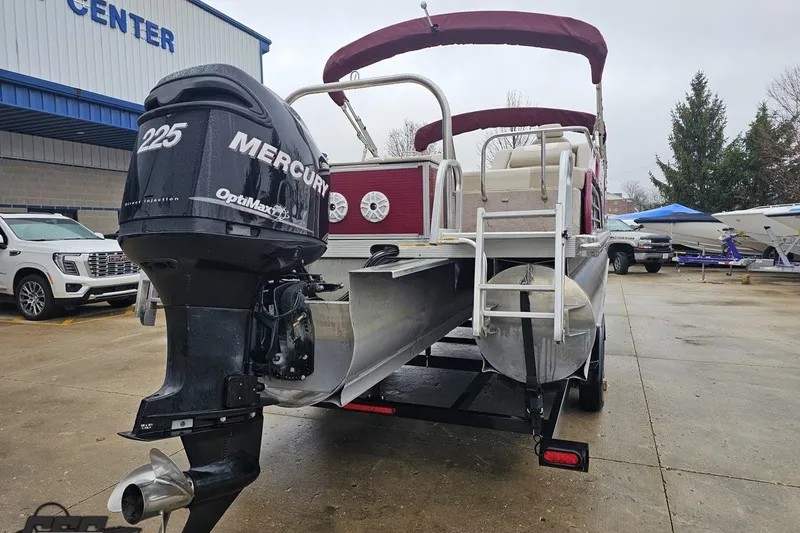 Slide: The Image of 2012 Tahoe Pontoon Vision 25' with Mercury 225 OptiMax engine at a boat center. - 11