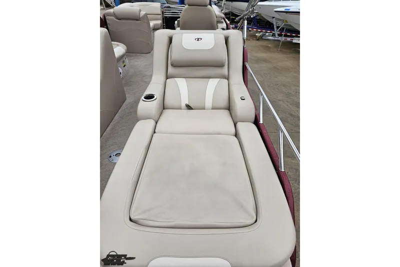 Slide: The Image of Luxurious seating on 2012 Tahoe Pontoon Vision 25' boat, featuring beige upholstery. - 17