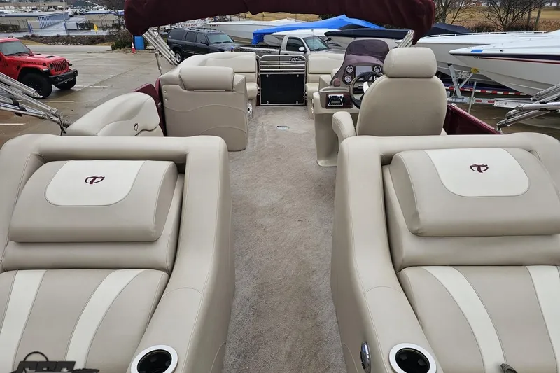 Slide: The Image of Luxurious 2012 Tahoe Pontoon Vision 25' interior with plush seating and modern helm. - 19