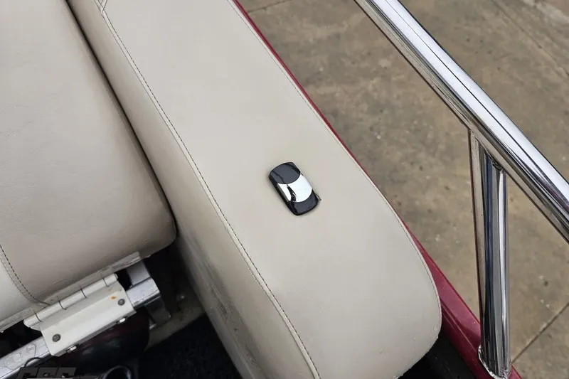 Slide: The Image of 2012 Tahoe Pontoon Vision 25' boat seat with chrome detail and railing. - 22