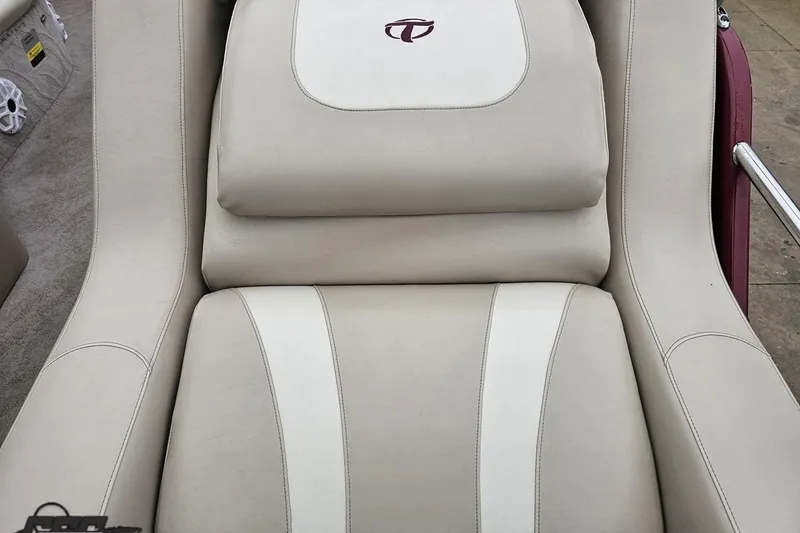 Slide: The Image of Luxurious seating on a 2012 Tahoe Pontoon Vision 25' boat, featuring beige upholstery. - 23