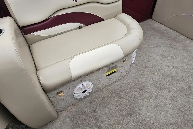 Slide: The Image of 2012 Tahoe Pontoon Vision 25' interior with beige and maroon seating, carpeted floor. - 28