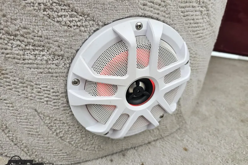 Slide: The Image of White speaker on 2012 Tahoe Pontoon Vision 25' boat, mounted on textured surface. - 32