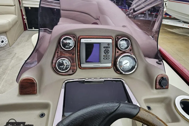 Slide: The Image of Dashboard of a 2012 Tahoe Pontoon Vision 25' with Garmin GPS and gauges. - 40