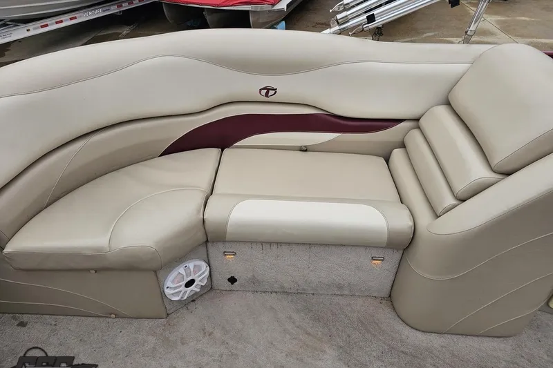 Slide: The Image of 2012 Tahoe Pontoon Vision 25' boat interior with beige seating and maroon accents. - 48