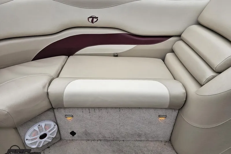 Slide: The Image of 2012 Tahoe Pontoon Vision 25' boat interior with beige seating and speaker. - 49