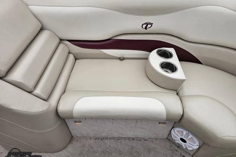 Slide: The Image of 2012 Tahoe Pontoon Vision 25' interior with beige seating and cup holders. - 50
