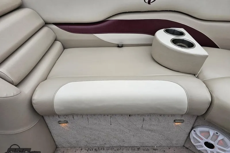 Slide: The Image of 2012 Tahoe Pontoon Vision 25' boat interior with beige seating and cup holders. - 51