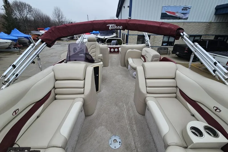 Slide: The Image of 2012 Tahoe Pontoon Vision 25' boat with beige seating and maroon accents. - 52