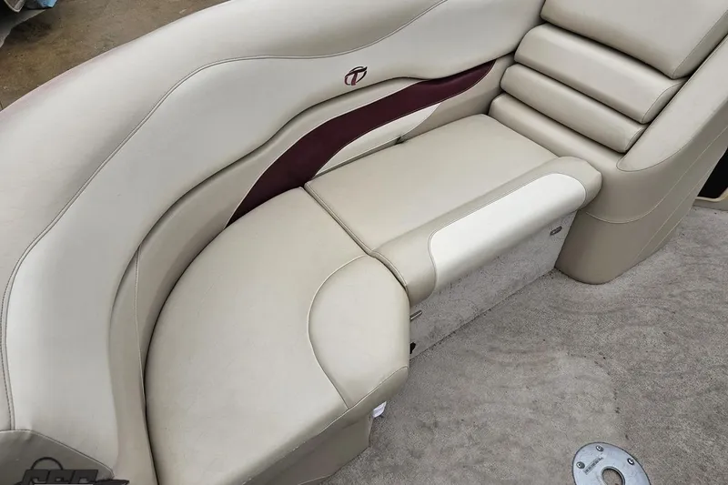 Slide: The Image of Luxurious seating on a 2012 Tahoe Pontoon Vision 25' boat, featuring beige upholstery. - 54