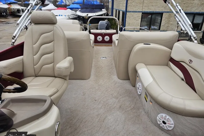 Slide: The Image of 2012 Tahoe Pontoon Vision 25' interior with beige seating and modern design. - 57
