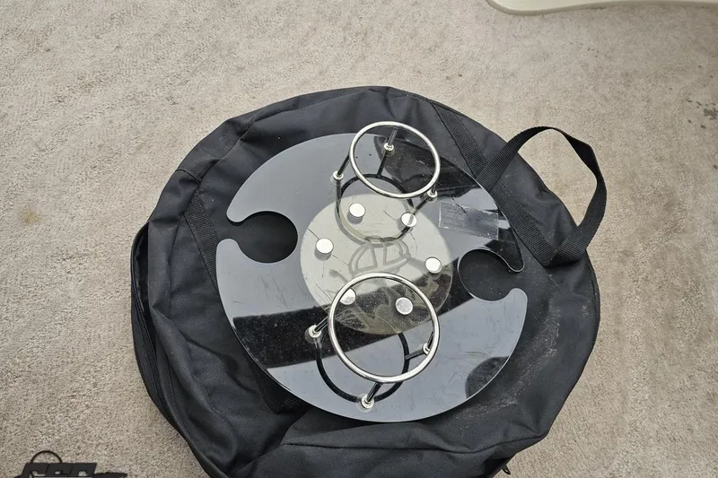 Slide: The Image of Circular black bag with metal cup holders on a 2012 Tahoe Pontoon Vision - 25'. - 61