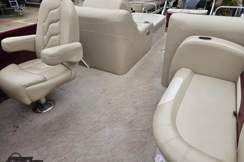 Slide: The Image of 2012 Tahoe Pontoon Vision 25' interior with beige seating and carpeted floor. - 62