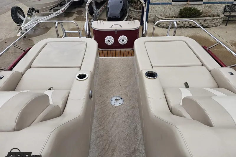 Slide: The Image of 2012 Tahoe Pontoon Vision 25' boat interior with beige seating and cup holders. - 66