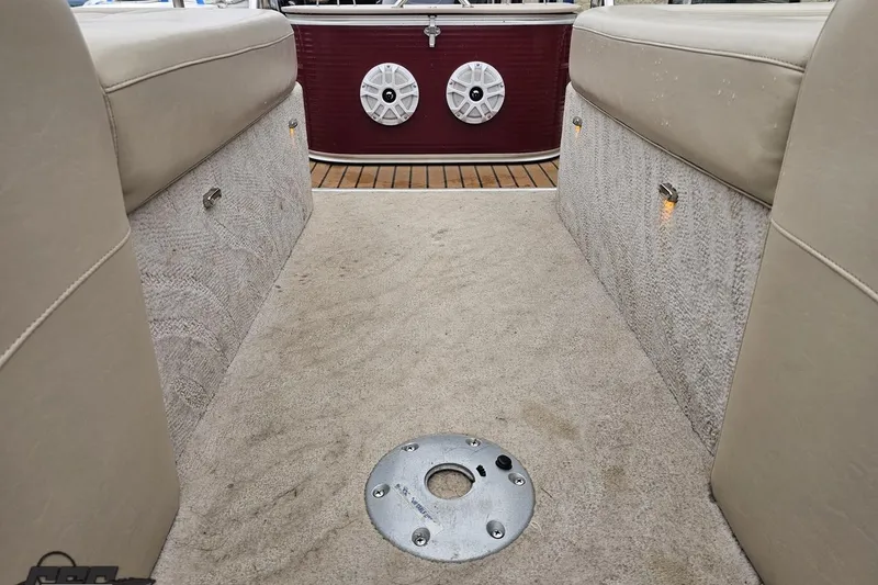 Slide: The Image of Interior of 2012 Tahoe Pontoon Vision 25' with beige seating and speaker system. - 67