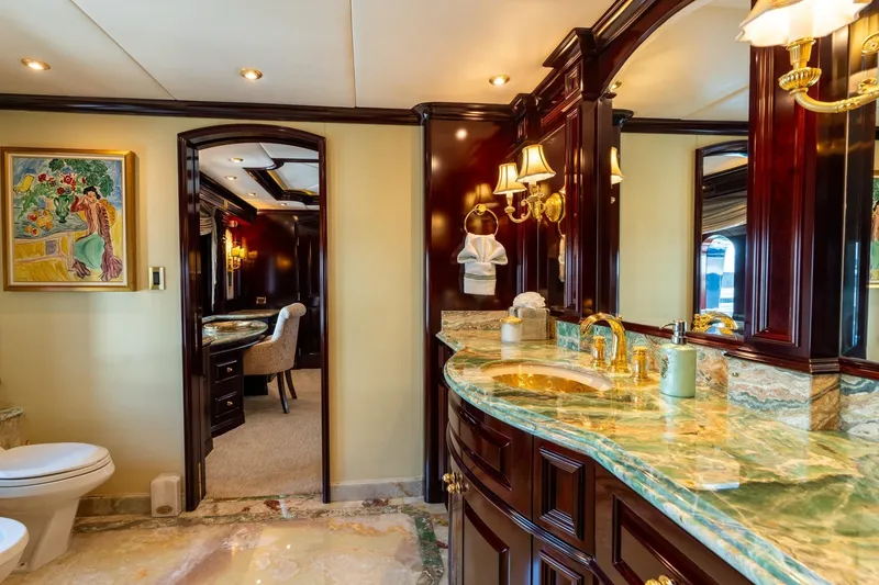 Slide: The Image of Luxurious bathroom on 2006 Trinity Tri-Deck Motor Yacht with marble countertops and elegant decor. - 10