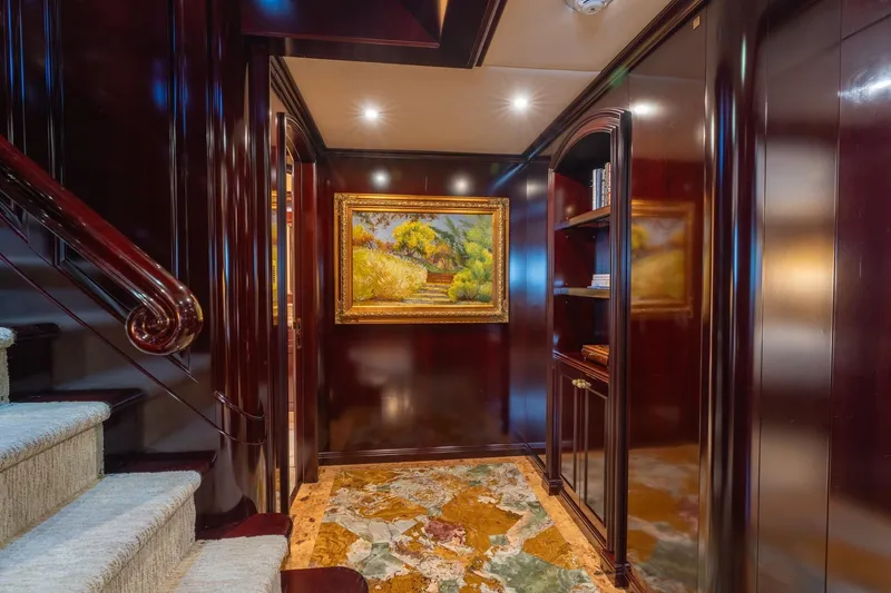 Slide: The Image of Luxurious interior of 2006 Trinity Tri-Deck Motor Yacht with elegant wood paneling and artwork. - 13