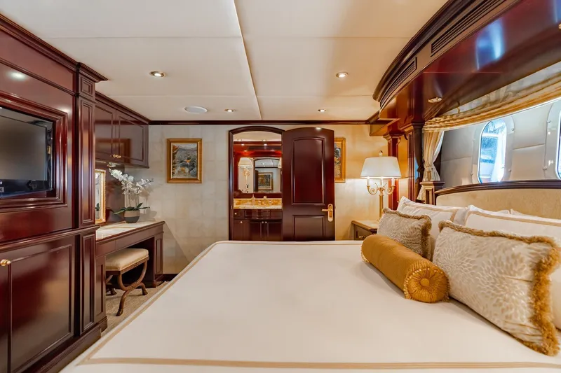 Slide: The Image of Luxurious bedroom interior of 2006 Trinity Tri-Deck Motor Yacht with elegant wood finishes. - 14