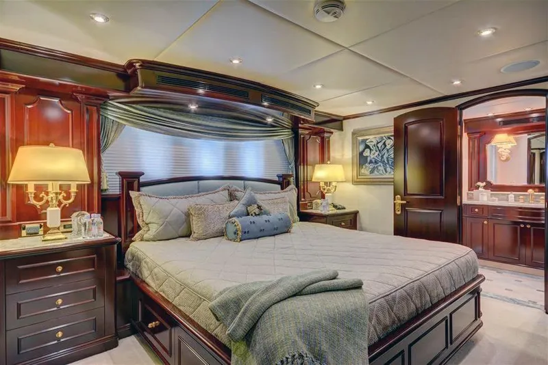 Slide: The Image of Luxurious bedroom interior of 2006 Trinty Tri-Deck Motor Yacht with elegant wood finishes. - 19