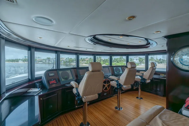 Slide: The Image of Luxurious helm of 2006 Trinity Tri-Deck Motor Yacht with panoramic windows and modern controls. - 21