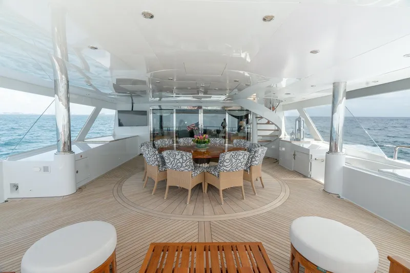 Slide: The Image of Luxurious 2006 Trinity Tri-Deck Motor Yacht with elegant outdoor seating and ocean view. - 28