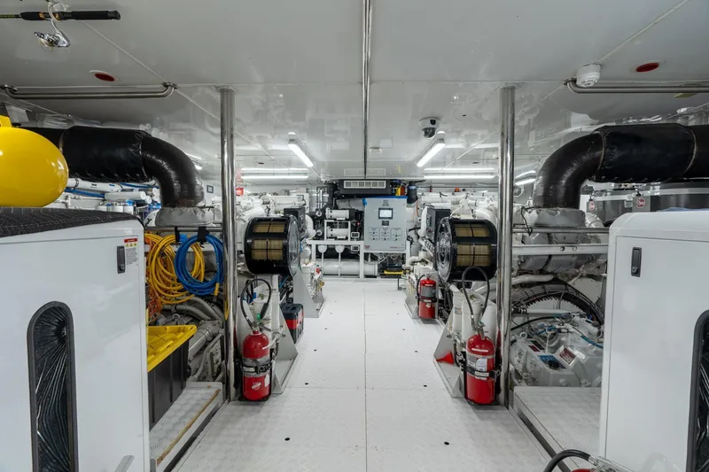Slide: The Image of Engine room of 2006 Trinity Tri-Deck Motor Yacht, featuring machinery and safety equipment. - 37